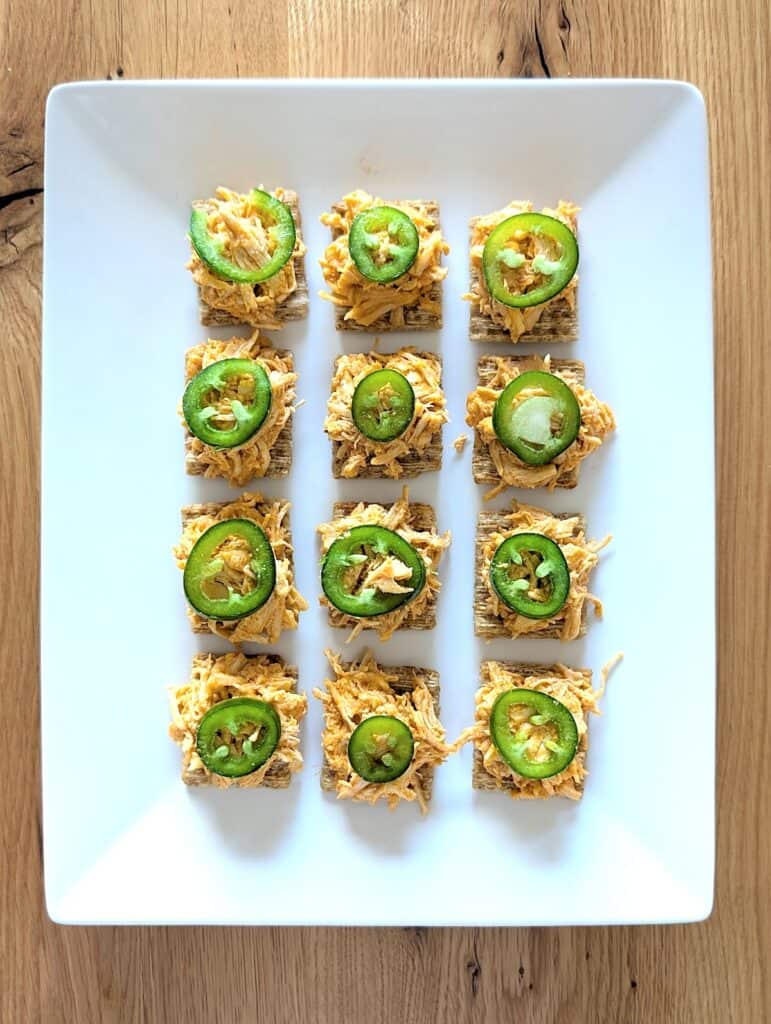 Easy Buffalo Chicken Dip Bites Recipe {On Crackers} on large white platter