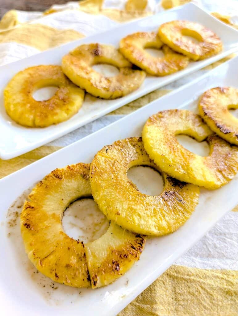 Grilled Pineapple Slices on two serving platters