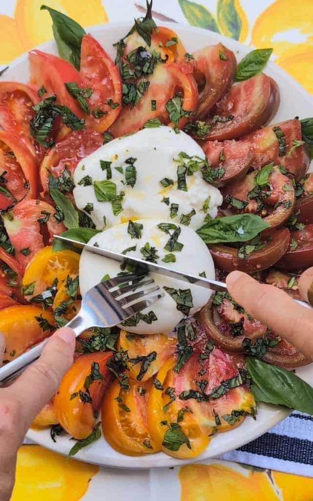 Summer Heirloom Tomato and Burrata Salad Recipe with fork and knife