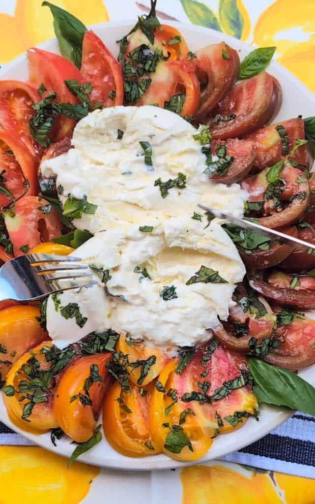 Summer Heirloom Tomato and Burrata Salad Recipe cutting cheese
