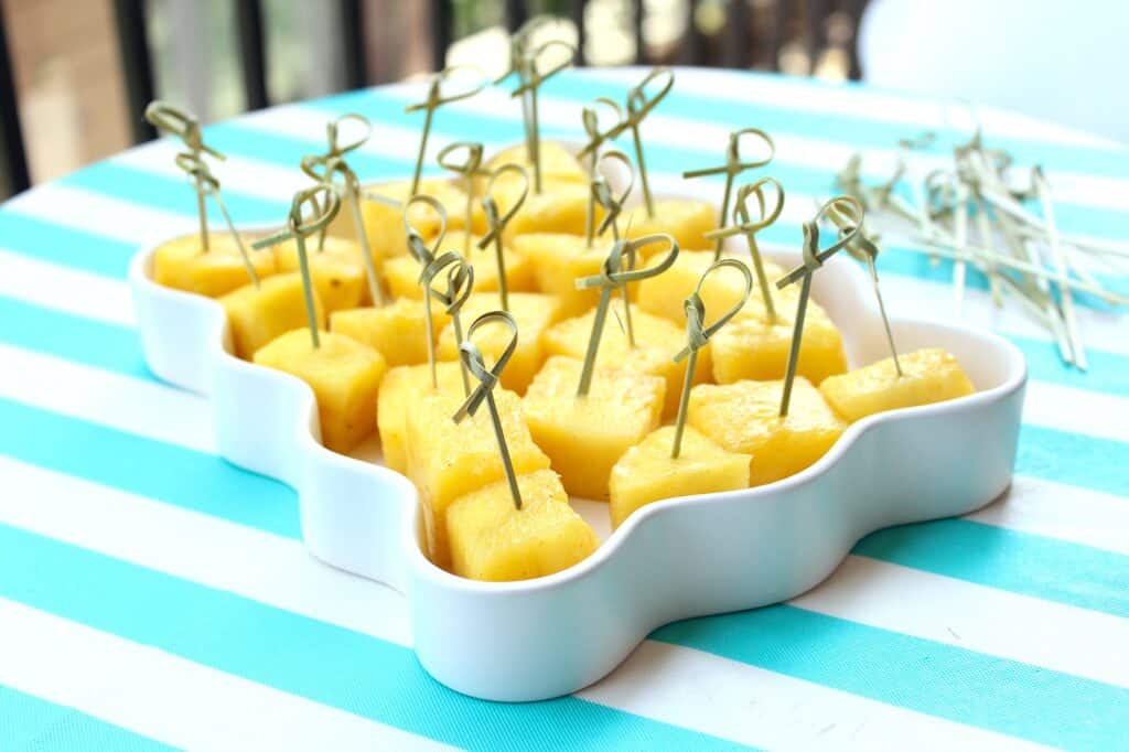 Boozy Fireball Infused Pineapple Bites on serving platter