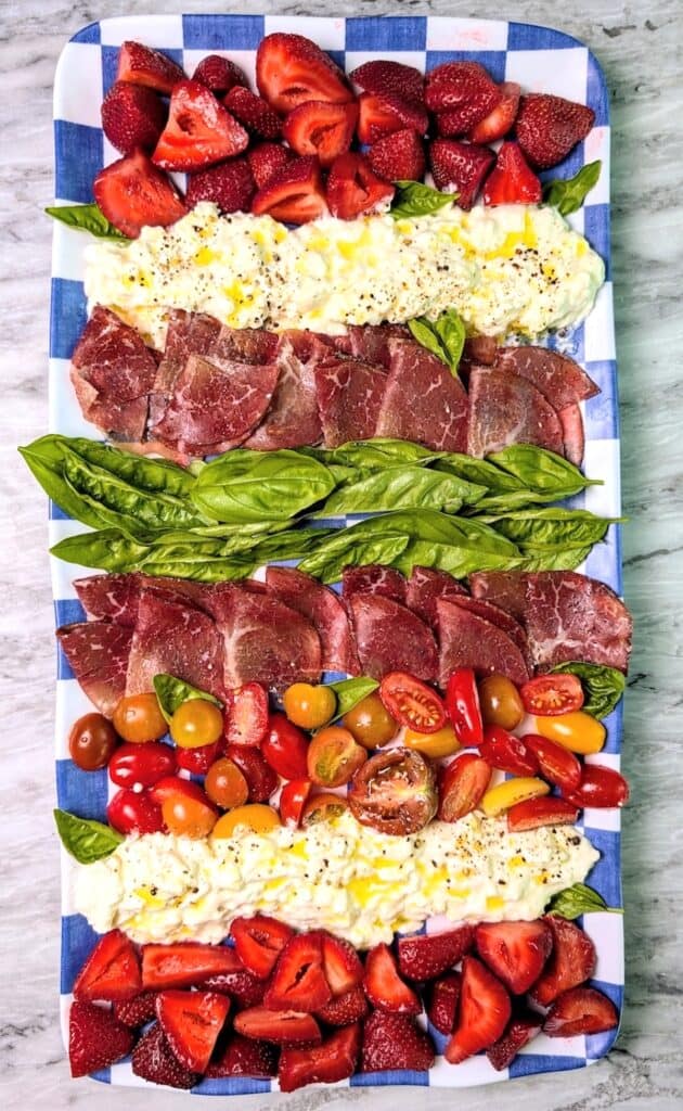 finished burrata charcuterie board on platter