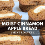 Delicious mini loaves of bread, sweetened with applesauce, with a beautiful slice of apple baked into the top.