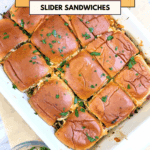 Creamy chicken bacon ranch slider sandwiches with fresh herbs in a baking dish.