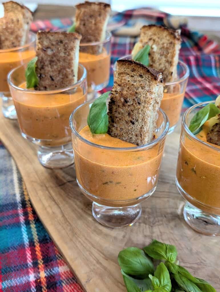 close up of Tomato basil Bisque with Goat Cheese and Calabrian chili oil
