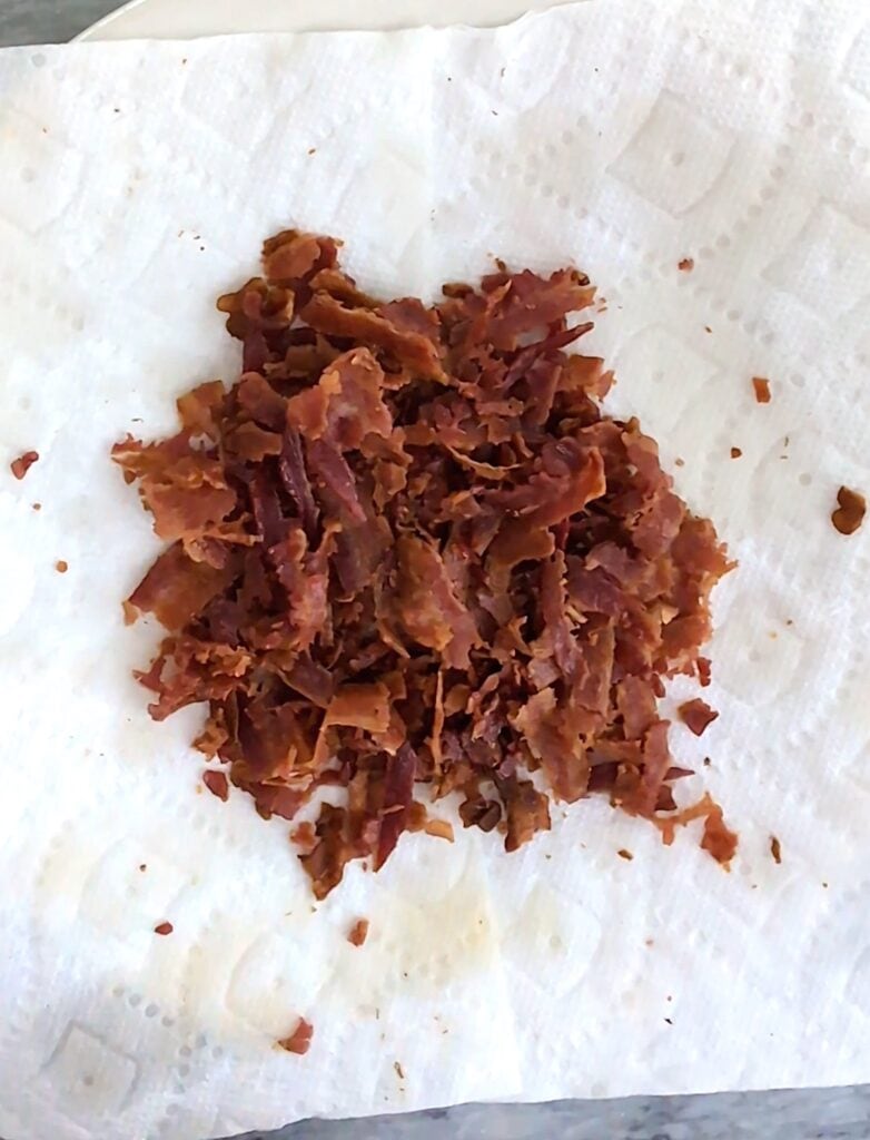 Cheddar Bacon Ranch Football Cheese Ball cooked bacon
