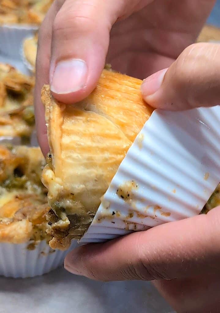 close of removing Mini Green Bean Casserole Cups from silicon baking liner