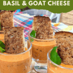 Rich and creamy tomato soup featuring basil, goat cheese, and a hint of Calabrian chili oil, served in small dessert bowls for a party