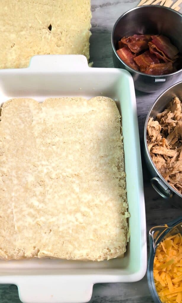 slider bottom buns with mayo in baking dish