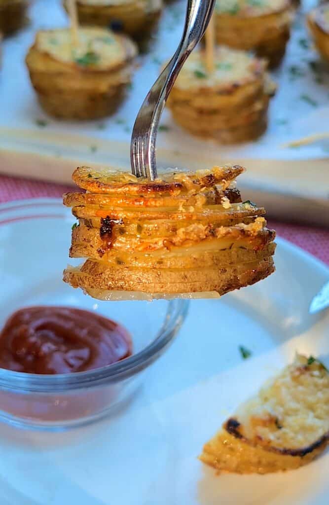 a fork holding the the crispy potato stack showing the outside layers