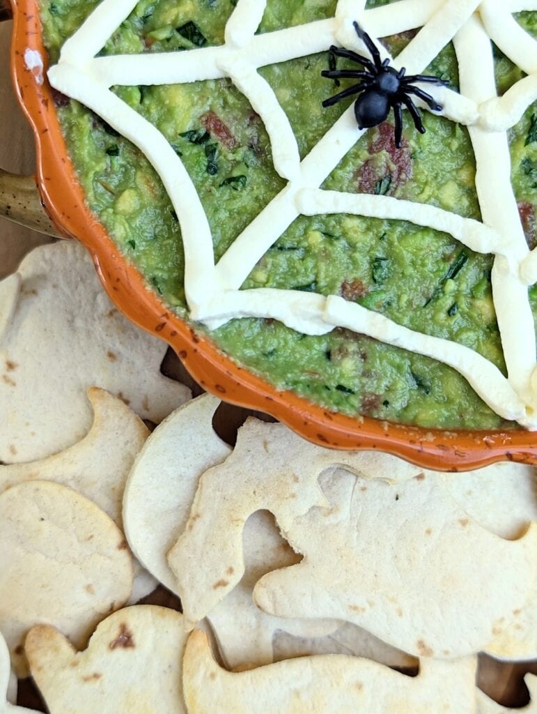 close up overhead shot of finished shot Halloween Guacamole with Spooky Chips