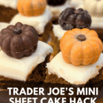 Close-up of several small pumpkin spice cake bites with white frosting, each topped with an assorted chocolate pumpkin (dark chocolate, orange, and white chocolate). Text overlay reads: "Trader Joe's Mini Sheet Cake Hack {pumpkin spice cake bites}."