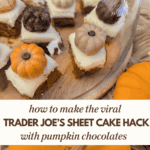 A close-up of the mini pumpkin spice cake bites on a wooden serving platter, with a glass dome partially covering them. Each bite is topped with a chocolate pumpkin. Text overlay reads: "how to make the viral Trader Joe's Sheet Cake Hack with pumpkin chocolates."