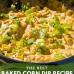 A dramatic close-up of the baked corn dip bubbling in a black dish, heavily garnished with sliced green onions. Text overlay reads: "The Best Baked Corn Dip Recipe {with cream-style corn}."