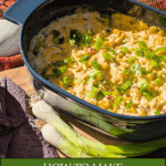 A high-angle shot of the baked, creamy corn dip in a blue dish, resting on a wooden board next to purple chips and fresh scallions. A plaid blanket provides a cozy background. Text overlay reads: "How to Make Creamy Corn Dip with Cream Cheese."