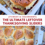 Close-up of a partially separated turkey cranberry slider on a white baking dish, showing the layers of sweet roll, golden stuffing, sliced turkey, and deep red cranberry sauce, above a full overhead view of the remaining poppy seed-topped sliders.