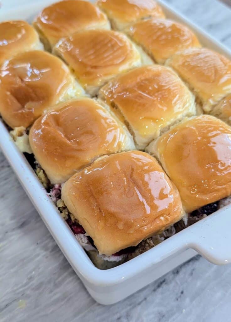 turkey cranberry sliders brushed with butter before baking