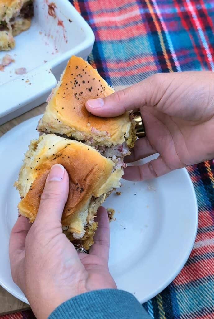Thanksgiving Turkey Cranberry Sliders with hands pulling apart