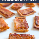 Close-up overhead photo of several baked candied bacon and cracker appetizers arranged on a white serving surface. The text overlay reads: "the ultimate CANDIED BACON CRACKERS APPETIZER."