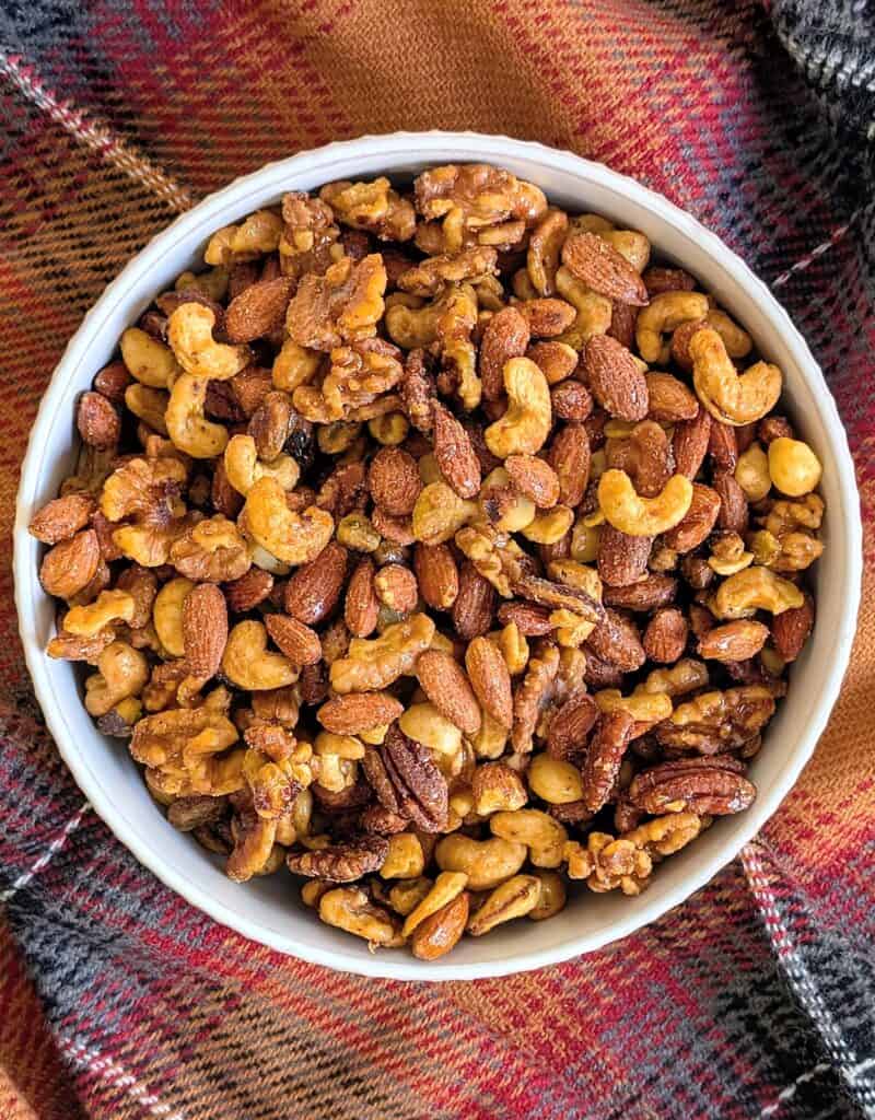 overhead shot of Candied Sweet and Spicy Nuts in white bowl