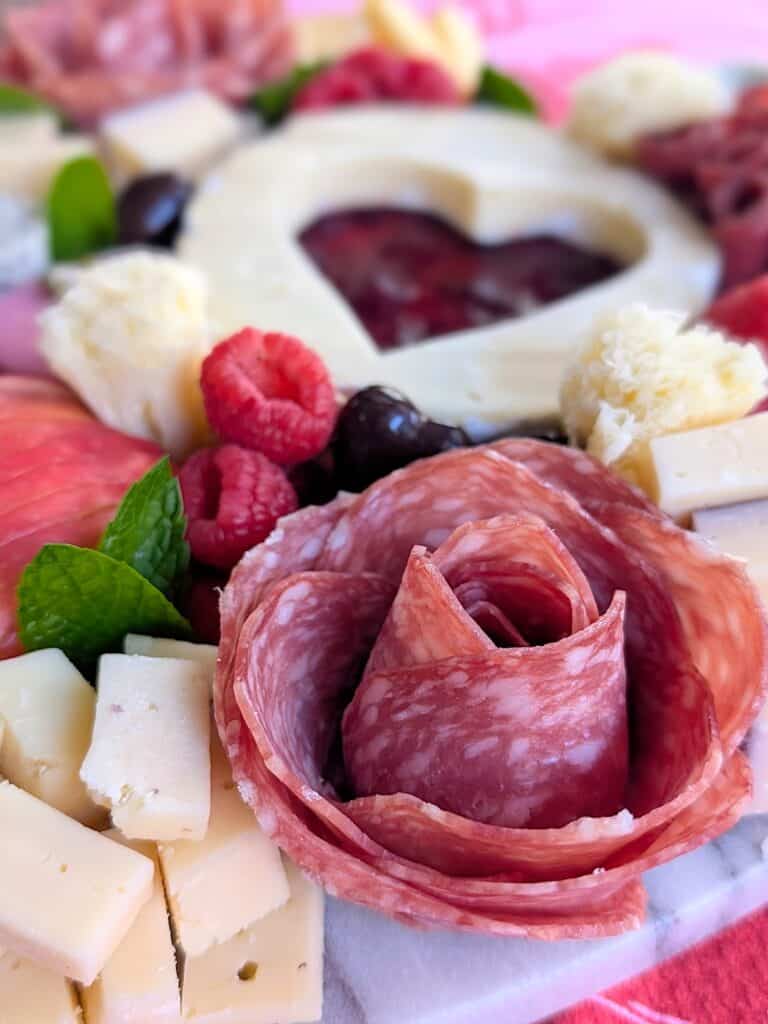 close up of salami rose on the Valentine Charcuterie board