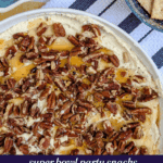 No-bake Boursin cheese dip topped with chopped pecans and hot honey, served with crackers and nuts.