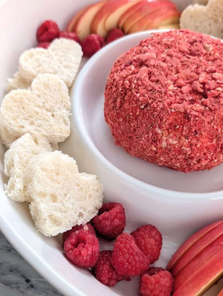 Strawberry Cream Cheese Dessert Cheese Ball recipe on a white platter