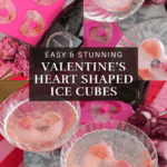 Multiple coupe glasses filled with pink sparkling drinks and heart-shaped ice cubes on a Valentine’s-themed table.