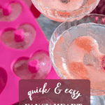 Heart-shaped ice cubes in sparkling drinks with pink tones and Valentine’s decorations.