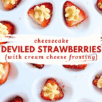 Top view of cheesecake deviled strawberries with piped frosting arranged on a serving platter.