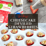 Strawberry halves filled with cream cheese frosting and topped with graham cracker crumbs on a white serving tray.